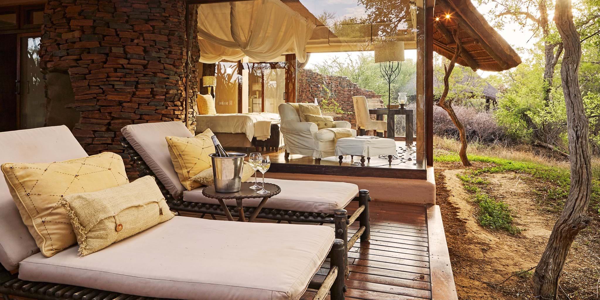 Champagne on the porch with views of the Savannah at Makanyane